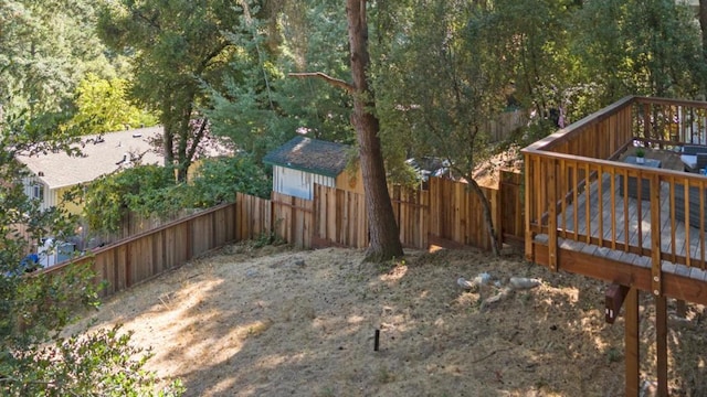 view of yard featuring a wooden deck