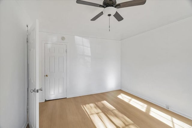 unfurnished room featuring ceiling fan and hardwood / wood-style floors