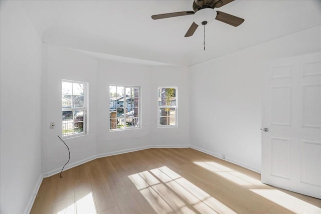 unfurnished room with ceiling fan and light wood-type flooring