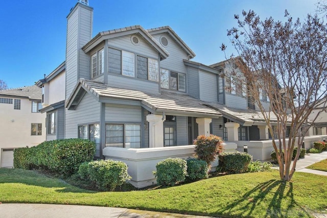 view of front of property with a front lawn