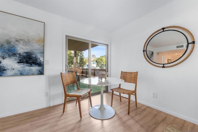 sitting room featuring light hardwood / wood-style flooring