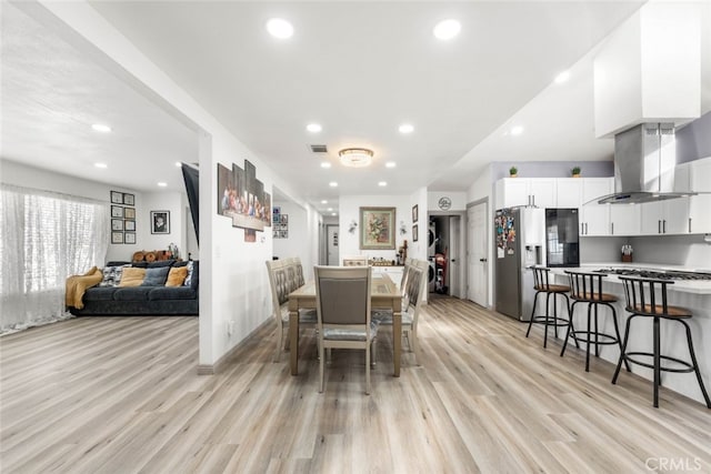 dining room with light hardwood / wood-style flooring