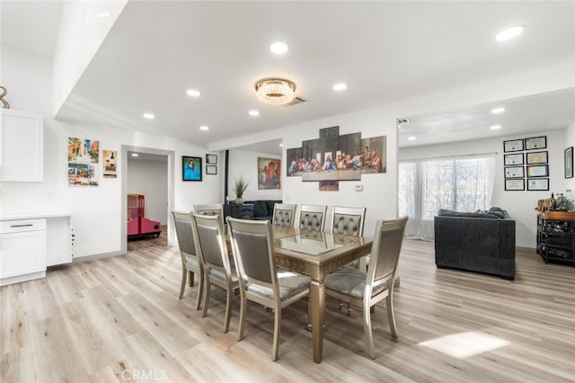 dining space featuring light hardwood / wood-style floors