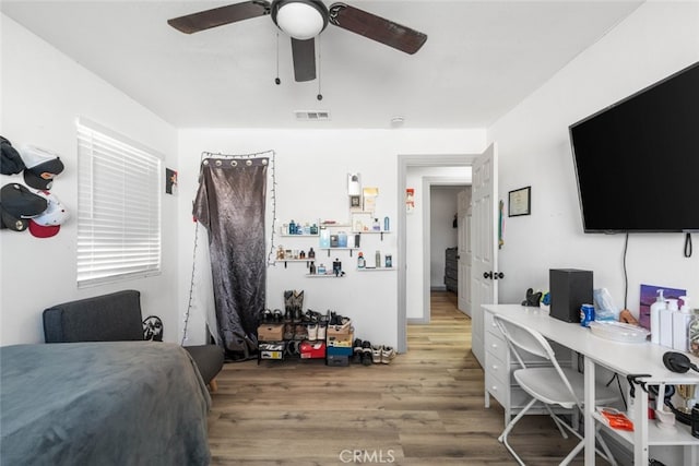 bedroom featuring ceiling fan and hardwood / wood-style floors