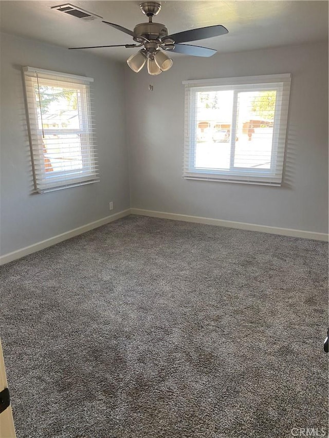 carpeted empty room with ceiling fan