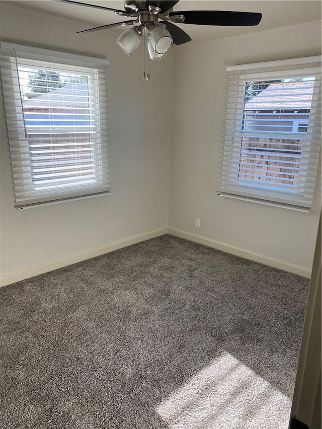 carpeted empty room featuring ceiling fan