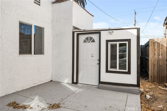 doorway to property featuring a patio