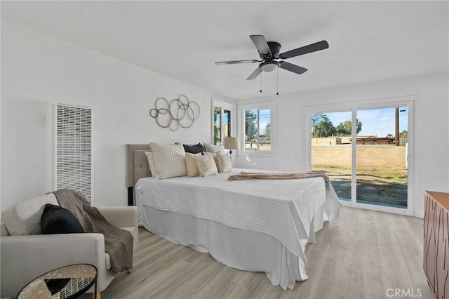 bedroom featuring ceiling fan, access to exterior, and light wood-type flooring