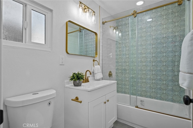 full bathroom with toilet, bath / shower combo with glass door, and vanity