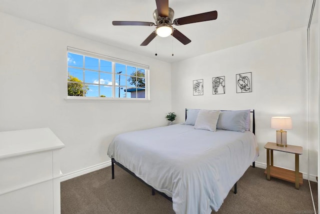 bedroom with dark carpet and ceiling fan