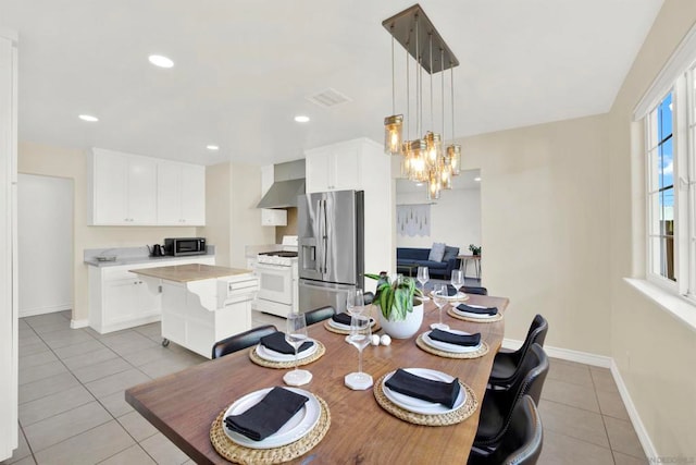 tiled dining area with a notable chandelier