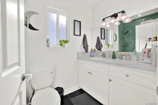 bathroom featuring tile patterned flooring, toilet, vanity, and a shower with curtain