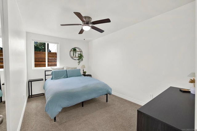 bedroom with ceiling fan and light colored carpet