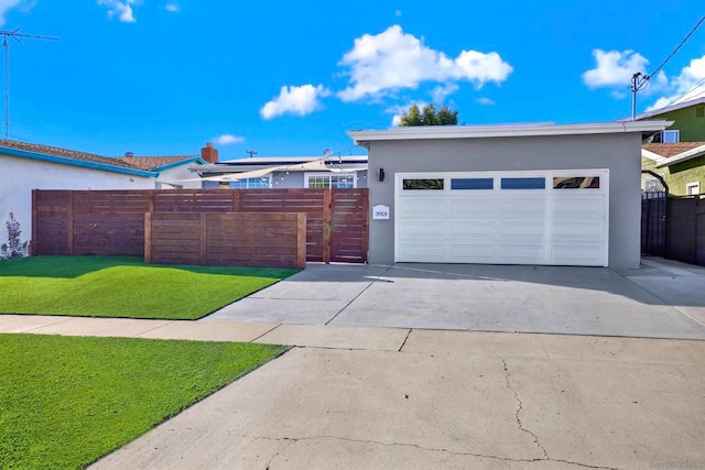 view of front facade featuring a front yard and a garage