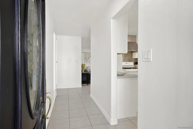 corridor with light tile patterned floors