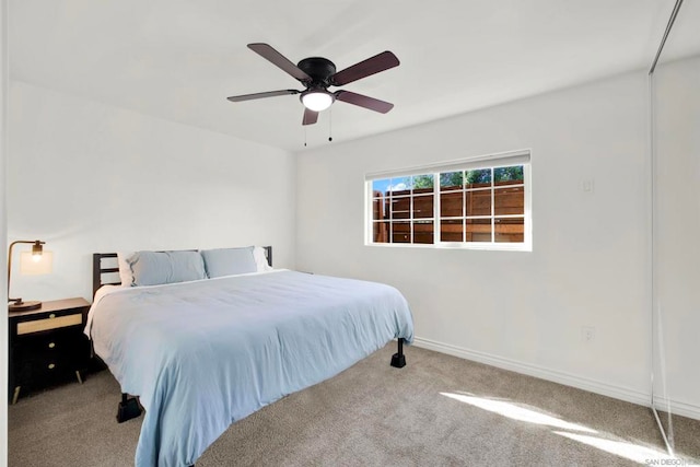 unfurnished bedroom with ceiling fan and light colored carpet