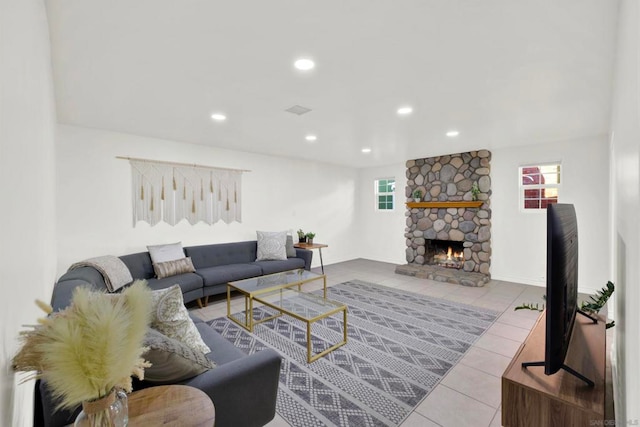 tiled living room featuring a fireplace