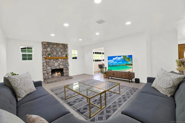 tiled living room with a fireplace