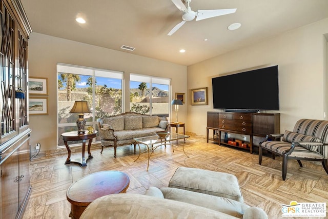 living room featuring ceiling fan and light parquet floors