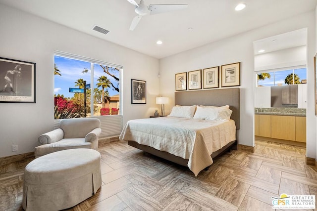 bedroom with light parquet floors and ceiling fan