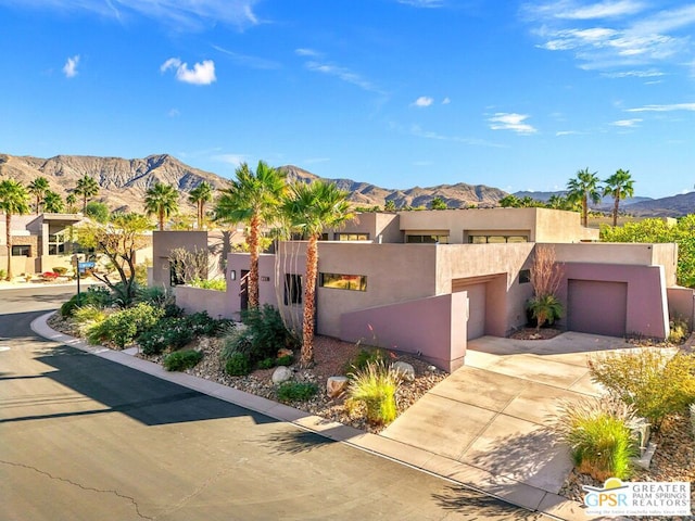 pueblo-style home featuring a mountain view