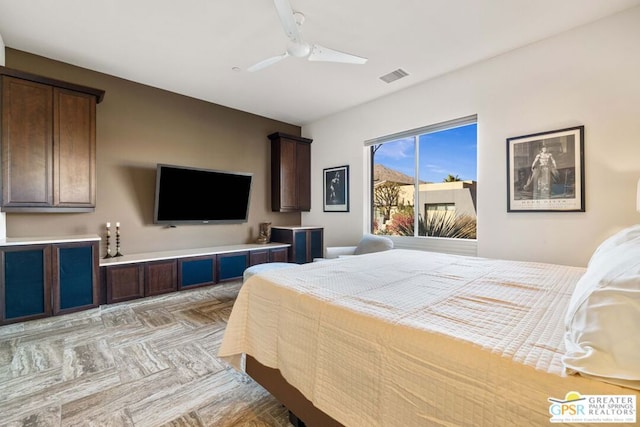 bedroom featuring light parquet floors and ceiling fan