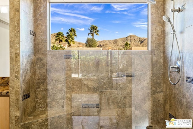 bathroom with a mountain view and tiled shower