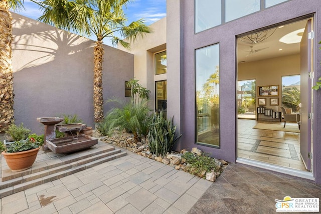 property entrance featuring a patio