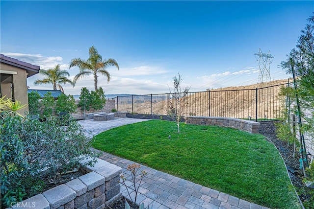 view of yard with a patio area and an outdoor fire pit