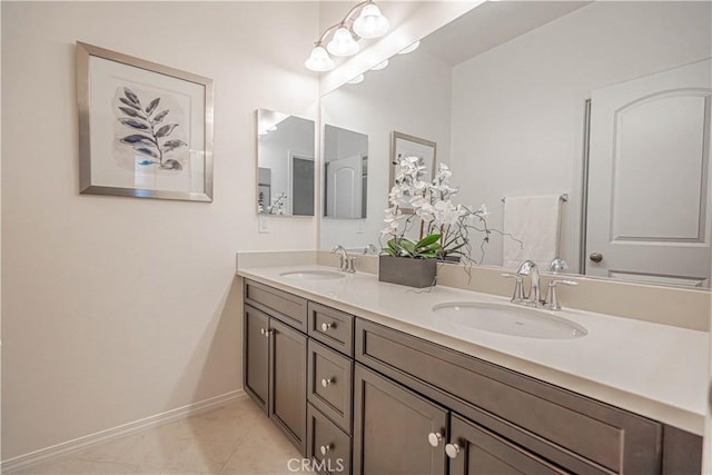 bathroom with tile patterned flooring and vanity