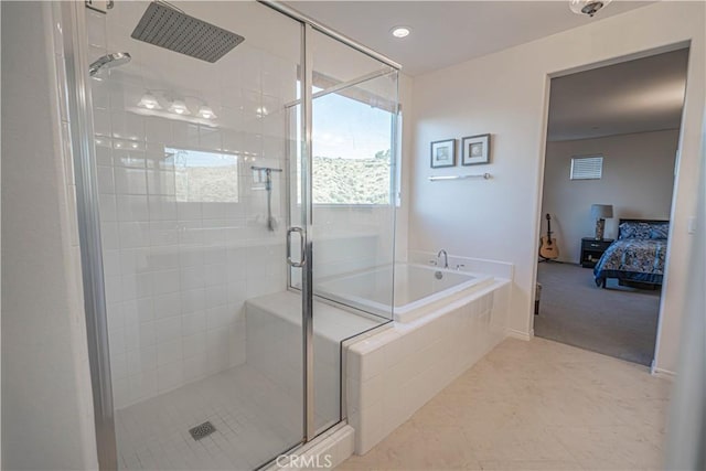 bathroom featuring tile patterned floors and separate shower and tub