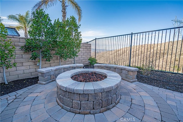 view of patio with a fire pit