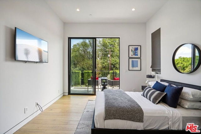 bedroom with light wood-type flooring