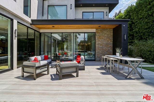 view of patio with an outdoor hangout area and a wooden deck