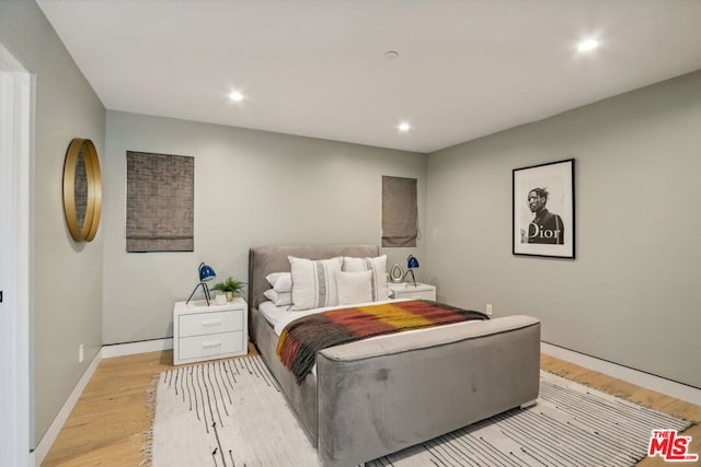 bedroom with light hardwood / wood-style flooring