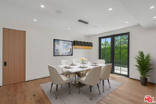 dining space featuring light hardwood / wood-style floors