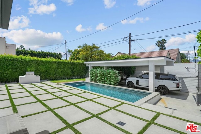 view of pool with a patio area