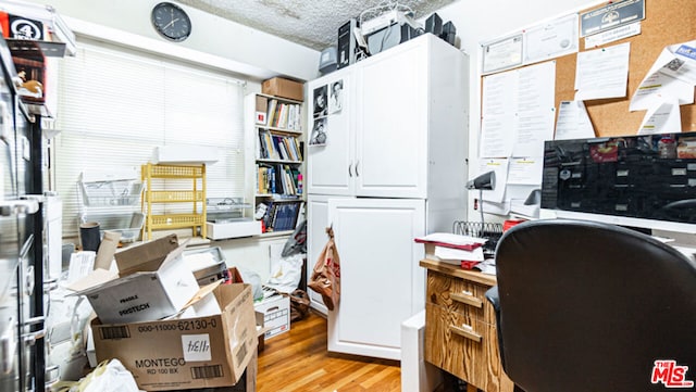 office area with light hardwood / wood-style floors