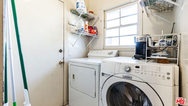 laundry room with independent washer and dryer