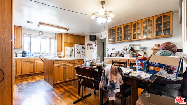 kitchen featuring a center island, a chandelier, and dark hardwood / wood-style floors