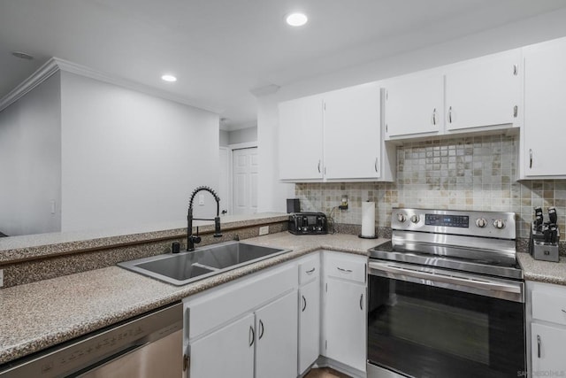 kitchen featuring crown molding, stainless steel appliances, sink, and white cabinets