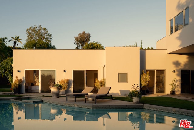 rear view of property featuring a patio