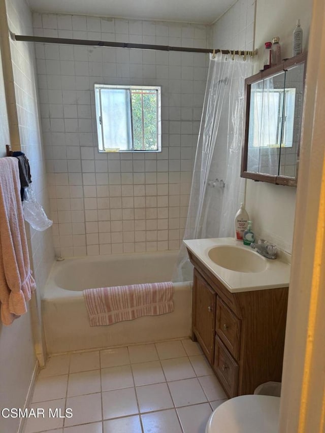 full bathroom featuring vanity, toilet, tile patterned floors, and shower / bath combo