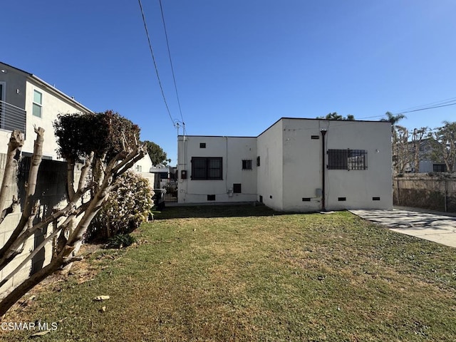 back of house with a yard