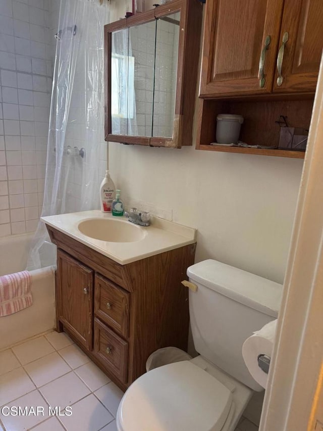 full bathroom featuring toilet, tile patterned flooring, shower / tub combo, and vanity