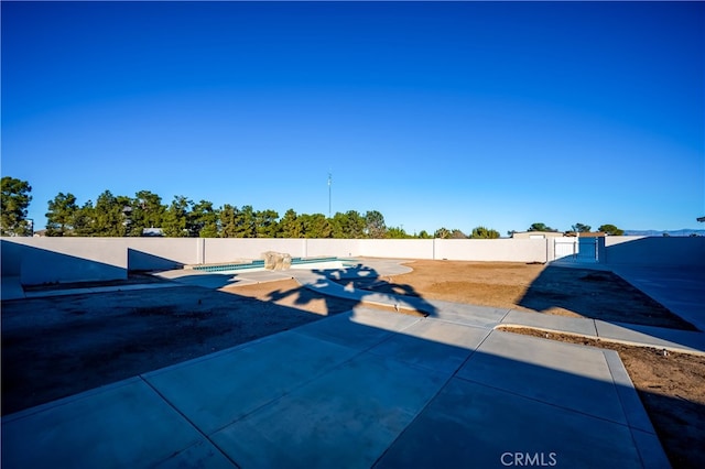 exterior space with a swimming pool