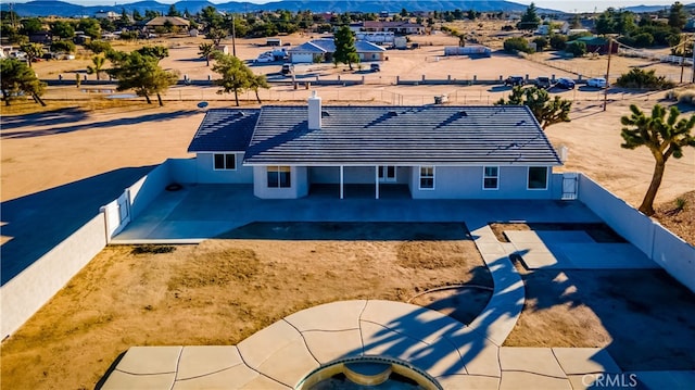 birds eye view of property featuring a mountain view