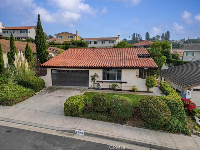 6954 Kings Harbor Dr, Rancho Palos Verdes, CA 90275 - mediterranean / spanish-style home with a tile roof, stucco siding, a residential view, and an attached garage