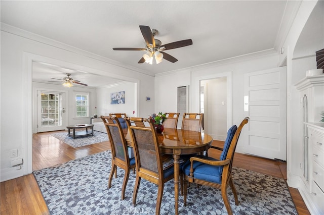 dining area with ceiling fan, hardwood / wood-style flooring, and crown molding