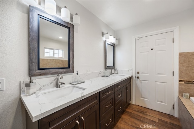 bathroom featuring wood-type flooring and vanity